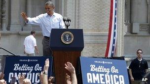 President Barack Obama points to the crowd as he arrives at Carnegie Mellon University in Pittsburgh, 6 July 2012