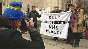 Campaigners against NHS Gloucestershire's plans arrive at the High Court in London