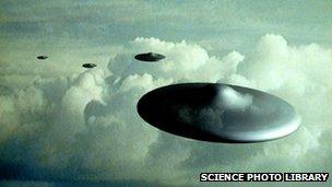 Artist's impression of flying saucers in flight