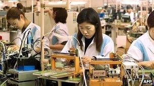 Female workers of Japanese electronics giant Sony assembling parts