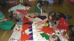 Llangynfelyn and Talybont primary school pupils making their Denmark banner