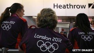 Volunteers waiting to greet arriving teams at Heathrow Airport in London