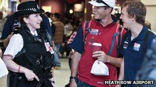 A police officer with members of the US sailing team