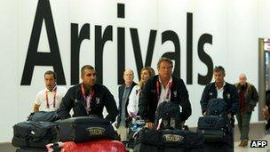 Members of Italy's Olympic shooting team arrive at Heathrow