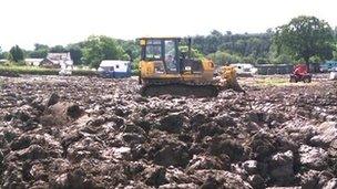 Diggers pulled vehicles out of the mud at the Great Yorkshire Showground in 2012