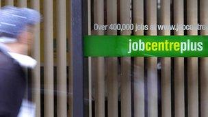 Man walking past job centre