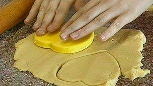 Student cutting out pastry