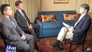 In this photo provided by the Fox News Channel, host Sean Hannity, right, interviews George Zimmerman, left, and his attorney Mark O’Mara