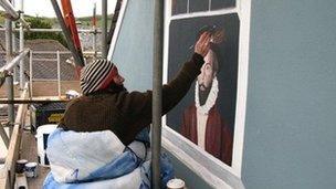 Emily Smith working on the mural