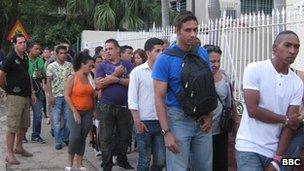 People queuing at an emigration office in Havana