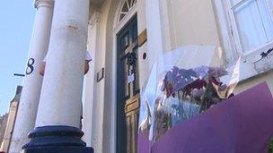 Flowers left in tribute to James Ward outside his offices in Devizes