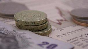 Coins and notes on newspaper