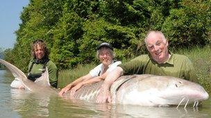 Guide Dean Werk and Margaret and Michael Snell with catch