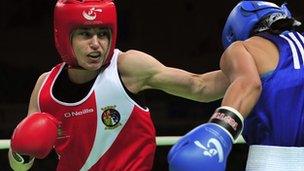 Katie Taylor throws a punch at Saida Khassenova of Kazakhstan during their women"s 60 kg division fourth round match at the AIBA World Women"s Boxing Championships in China in May