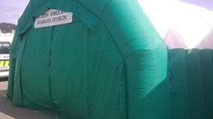 An inflatable tent