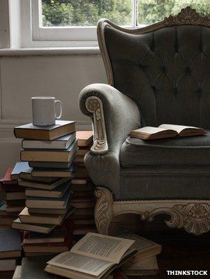 Pile of books and armchair