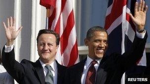 UK Prime Minister David Cameron and US President Barack Obama wave from the South Lawn of the White House 14 March 2012