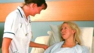 Nurse takes patient's temperature