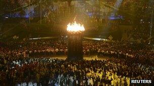 Athletes parade next to the Olympic flame at London 2012 Opening Ceremony