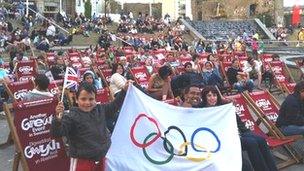 Crowd in Swansea watch Olympics opening ceremony on big screen