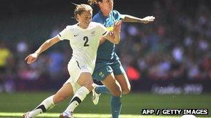 Brazil goalscorer Cristiane (R) vies with New Zealand defender Ria Percival at the Millennium Stadium