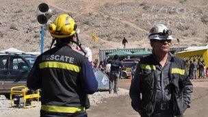 Two rescue workers at Camp Hope, Chile