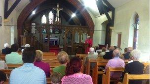 Parishioners joining in the final service at All Saints Church in Maerdy