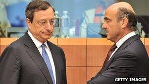 ECB President Mario Draghi and Spanish Finance Minister Luis De Guindos