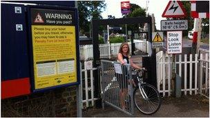 Cyclist using new railway level crossing at Foxton in Cambridgeshire