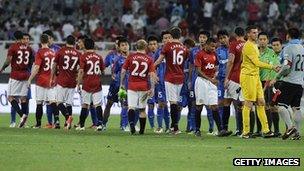 Manchester United line up against China's Shanghai Shenhua