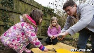 Children and adult playing