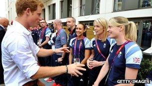 Prince Harry chats to athletes including Jessica Ennis and Nicola Sanders at the Olympic Village