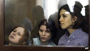 Three members of the Russian punk band Pussy Riot - Nadezhda Tolokonnikova (r), Mariya Alekhina (l) and Yekaterina Samutsevich (c) - pictured during their trial on hooliganism trial at Moscow's Khamovniki court on 30 July 2012