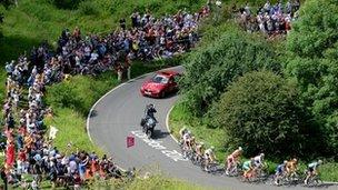 Cyclists on a hairpin bend at the base of the Box Hill climb