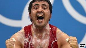 Uzbekistan's Sherzodjon Yusupov celebrates