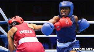 Nicola Adams punching Mary Kom