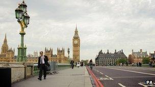 Westminster Bridge appears almost empty of pedestrians and vehicles during morning rush hour in central London.