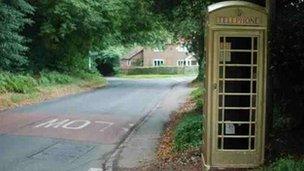 Golden phone box in Checkendon