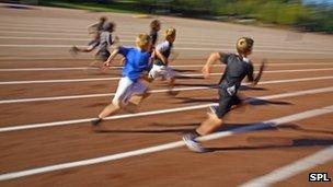 Children running on an athletics track