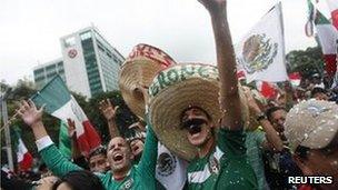 Mexican fans celebrate their football team's victory