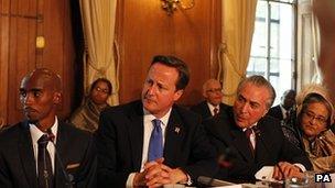 British athlete Mo Farah, Prime Minister David Cameron and Brazil's vice-president Michael Terner at the summit in London