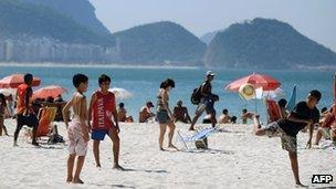 Children playing football on Rio's Copacabana beach