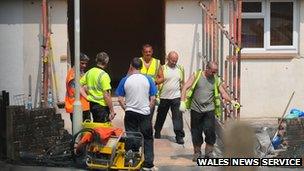 Builders cut a hole in the wall of the home of a 60 stone teenager