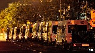 Police vans stand parked in Amiens, France, 15 August