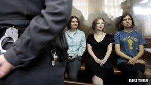 Members of the female Russian punk band Pussy Riot sit in court on 17 August 2012, when they were sentenced to two years in jail for an anti-Putin protest in a Moscow cathedral