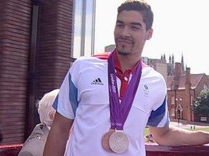 Louis Smith on open top bus