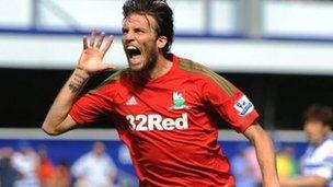 Michu celebrates after putting Swansea ahead