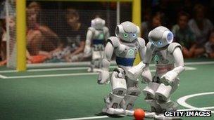 Robots play football at the Ideen Park fair on August 13, 2012 at the fair ground in Essen, western Germany.