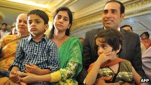 Indian cricketer Vangipurappu Venkata Sai (VVS) Laxman (R), wife Sailaja amd their children Sarvajith and Achinthya attend a press conference held to announce his retirement from Test Cricket at the Rajiv Gandhi International cricket stadium in Hyderabad on August 18, 2012.