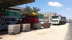 Long queue for fuel outside a petrol station